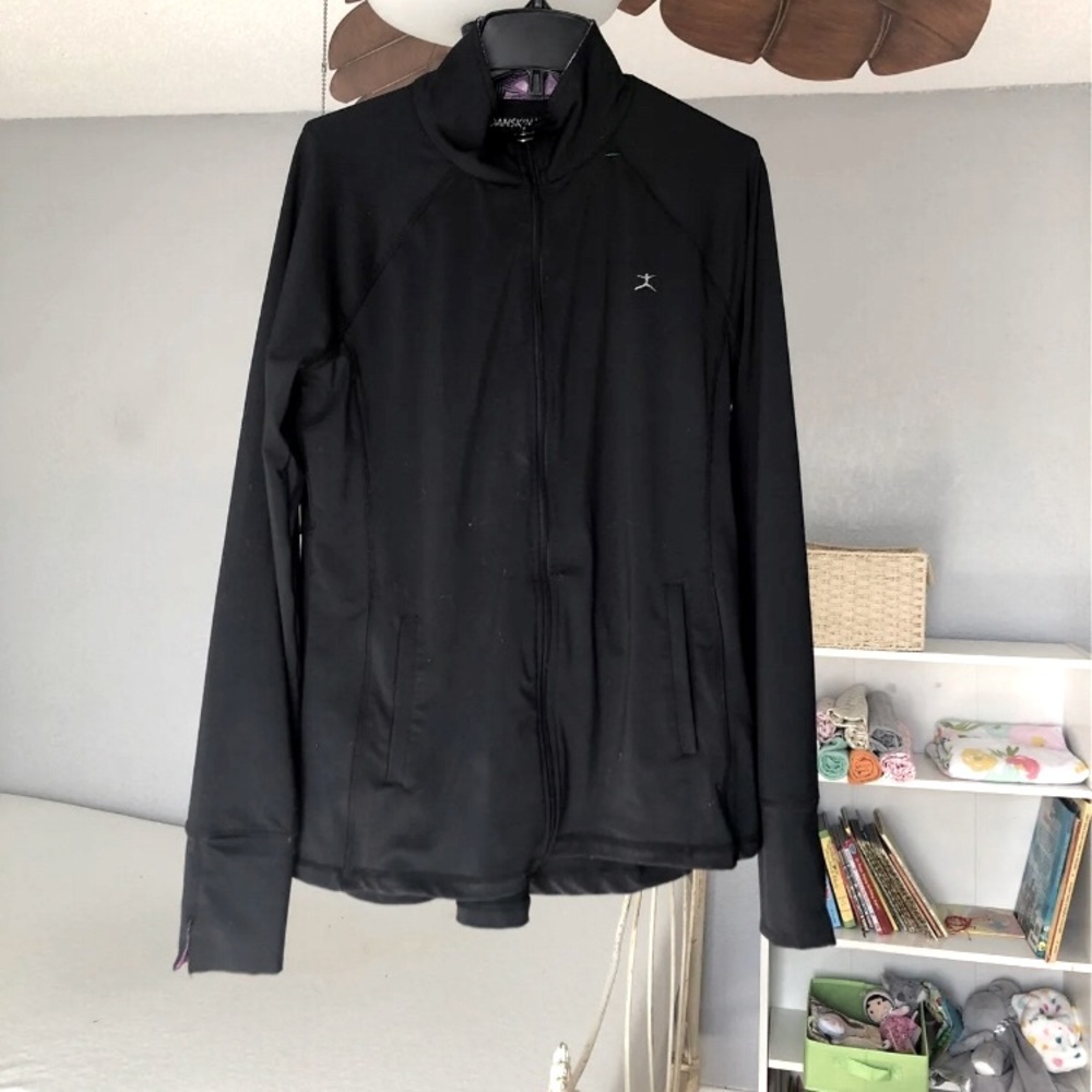 Black zip up athletic jacket from Danskin for women.